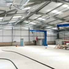 3 swing jib cranes on factory floor